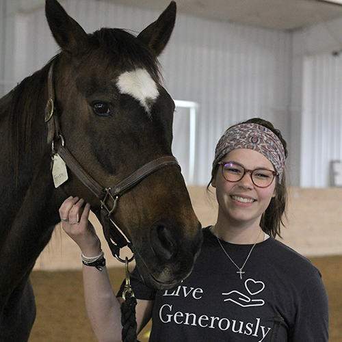 Intern standing next to Fresco.