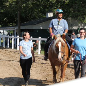 Rider smiles during her ride at the Renew Celebration Horse Show.