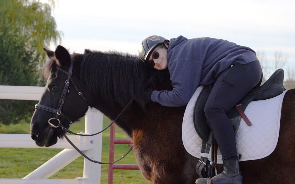 Felicity giving Babe a hug.